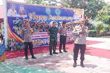 Kapolsek Tapung Hilir Hadiri Acara HUT SMA Negeri 1 ke 21 Tapung Hilir